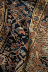 Hand-knotted pile of vintage Mehrivan rug, showing geometric blossoms in navy, dusty blush, and sky blue.