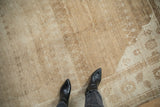 Low, even pile of a distressed Turkish carpet showing textural abrashes and faint lattice vines.