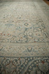 Distressed vintage Khorassan rug detail, showing heavy abrashes on muted floral and vine patterns.