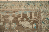 Mostly even wear showing knot heads on a vintage Hamadan rug corner with turquoise accents.