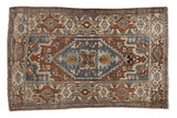 Vintage Distressed Hamadan rug, dusty blue medallion, chestnut brown geometric motifs, and soft patina.