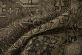Detail of vintage distressed Mehrivan carpet, revealing heavy abrashes, worn pile, and muted brown-silver palette.
