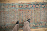 Distressed antique Malayer runner, worn field with lattice floral pattern and dusty teal border.