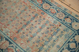 Antique Malayer runner detail: distressed texture, visible foundation, terracotta and dusty teal lattice florals.
