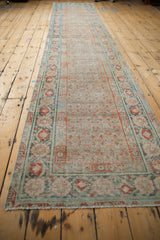 Antique distressed Malayer runner end, worn terracotta and dusty teal pomegranate vine border, fringe.