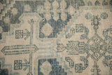 Primitive floral and pinwheel motifs on distressed Hamadan runner in dusty teal, blue, ivory.
