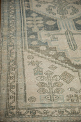 Distressed vintage Hamadan rug with primitive floral motifs in dusty teal and ivory.