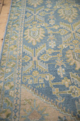 Vintage Hamadan runner's distressed blue pile with pale gold and green serrated leaf motifs.