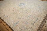 Distressed Afghani Oushak carpet with pale lime green, sky blue, and dusty rose floral palmettes.