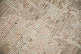 Distressed Oushak high sheen wool pile, showing shearing in soft ivory, beige, and blush.