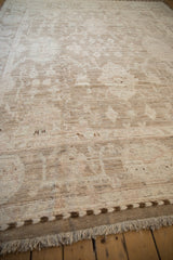 Distressed Afghani Oushak rug's woven side cord selvage and soft ivory fringe.
