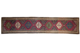 Antique Karabagh runner, interconnected floral medallions in purple, sapphire blue, green, and ivory tones.