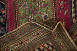 Antique Karabagh runner's folded corner reveals hand-knotted foundation and floral pile.