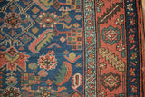 Antique Heriz rug with cobalt field, Herati design motif, and madder red serrated leaf border.