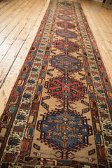 Vintage Serab runner viewed down its full length, highlighting the repeating geometric medallions.