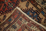 Folded corner of a vintage Persian Serab runner showing its dense wool pile and hand-knotted foundation.