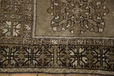 Distressed Melas runner corner, geometric border, quatrefoil, ochre and olive hues.