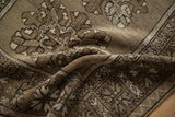 Textured low pile of the distressed vintage Melas runner in geometric ochre and olive.