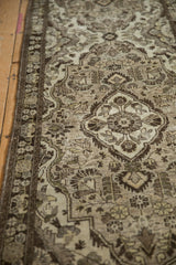 Low-pile texture and intricate floral motifs in chocolate brown on a vintage Dargezine runner.