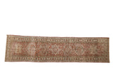 Distressed vintage Karaja runner with geometric medallions, starburst border, raspberry and beige, 2'8