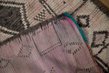 Reverse side of a vintage Moroccan rug with polychromatic warps and unique tinsel accents.