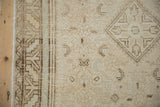Distressed vintage Hamadan runner: serrated leaf design, faded blue accents, and even knot wear.