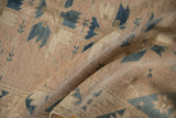 A soft fold in the vintage Oushak runner showing its low pile and hand-knotted texture.