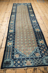 Vintage Peking rug's geometric blossoms lattice pattern in dusty blue, sand, and mauve.