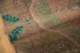 Textured, distressed vintage Northwest Persian rug pile showing knot head wear, dusty turquoise, ochre.