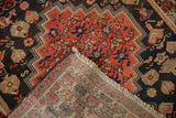 Detailed view of the hand-knotted foundation and wool pile on an antique Persian Malayer rug.