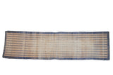 Distressed Oushak runner with dusty blue diamond pattern on faded ivory.