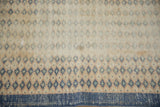 Distressed Oushak runner shows detailed diamond blossoms, exposed foundation, and dusty blue-green tones.