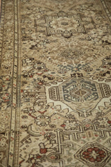 Angled view showing the worn texture and geometric motifs of the vintage Karaja runner.