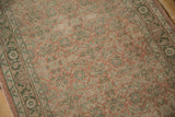 Worn dusty rose Herati field and pale green inverted turtle border on a vintage Hamadan rug.