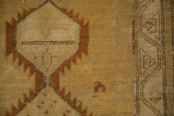 Vintage Distressed Serab rug detail, showing lightening serrated geometric motif in chestnut and pale saffron.