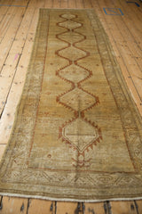 Distressed Serab runner, hexagonal medallion showing softened saffron and chestnut geometric motifs.