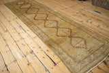 Distressed texture, geometric border, and intact selvage on a vintage Serab runner.