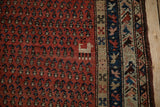 Antique Kurdish Hamadan runner: madder red boteh field, animal, sapphire blue border.