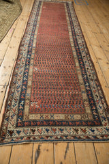 Vibrant madder red and sapphire blue repeating boteh with tiny animal motifs.