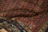 Antique Kurdish Hamadan runner with vivid madder red boteh field and geometric border.