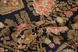 Hand-knotted pile of an antique Karabagh rug with blush and copper serrated leaf motifs.