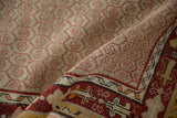 Hand-knotted vintage Oushak runner pile, close-up of muted red and ivory hexagonal patterns.