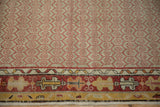 Vintage Oushak runner detail: red honeycomb field, geometric borders in ivory, cherry, saffron.