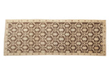 Vintage distressed Oushak runner with coffee brown and cream lattice floral pattern.
