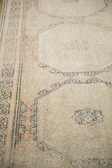 Softened vintage Sparta rug texture with distressed pale sandalwood guls and oxidized silver accents.
