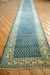 Distressed blue Mir Sarouk runner border with ivory meandering vines and subtle floral field wear.