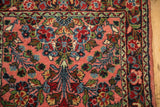 Vintage Dargezine runner corner with dusty rose field, floral motifs, and original side selvage.