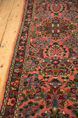 Dargezine rug runner's side cord selvage and repeating floral thousand flower motif in dusty rose, sky blue, and green.