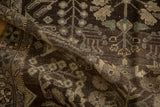 Distressed vintage Dargezine runner texture with worn floral motifs in chocolate and platinum tones.