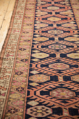 Distressed Kurd runner pile showing navy blue, burnt orange serrated guls and softened texture.
